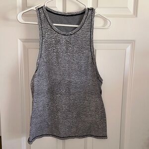 Lululemon tank, black and white, shorter in back than the front. Size 8